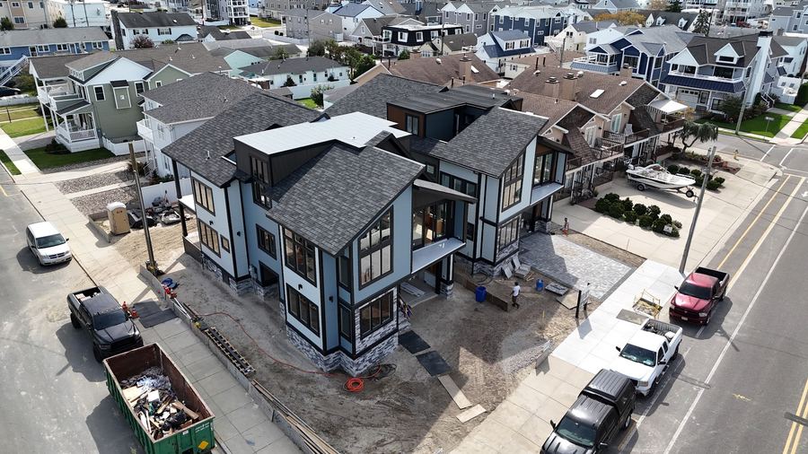 Corner view of the Wildwood Crest homes under construction, with exterior work wrapping up