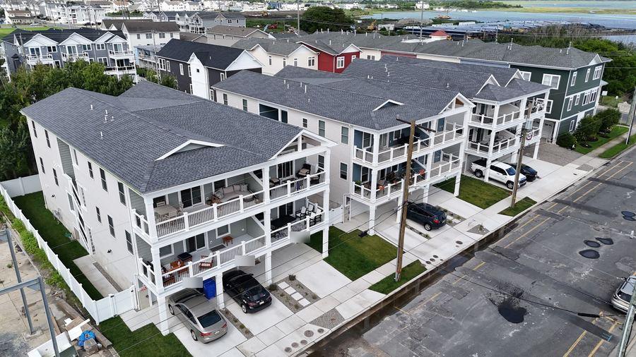 Angled view down the row of three new homes